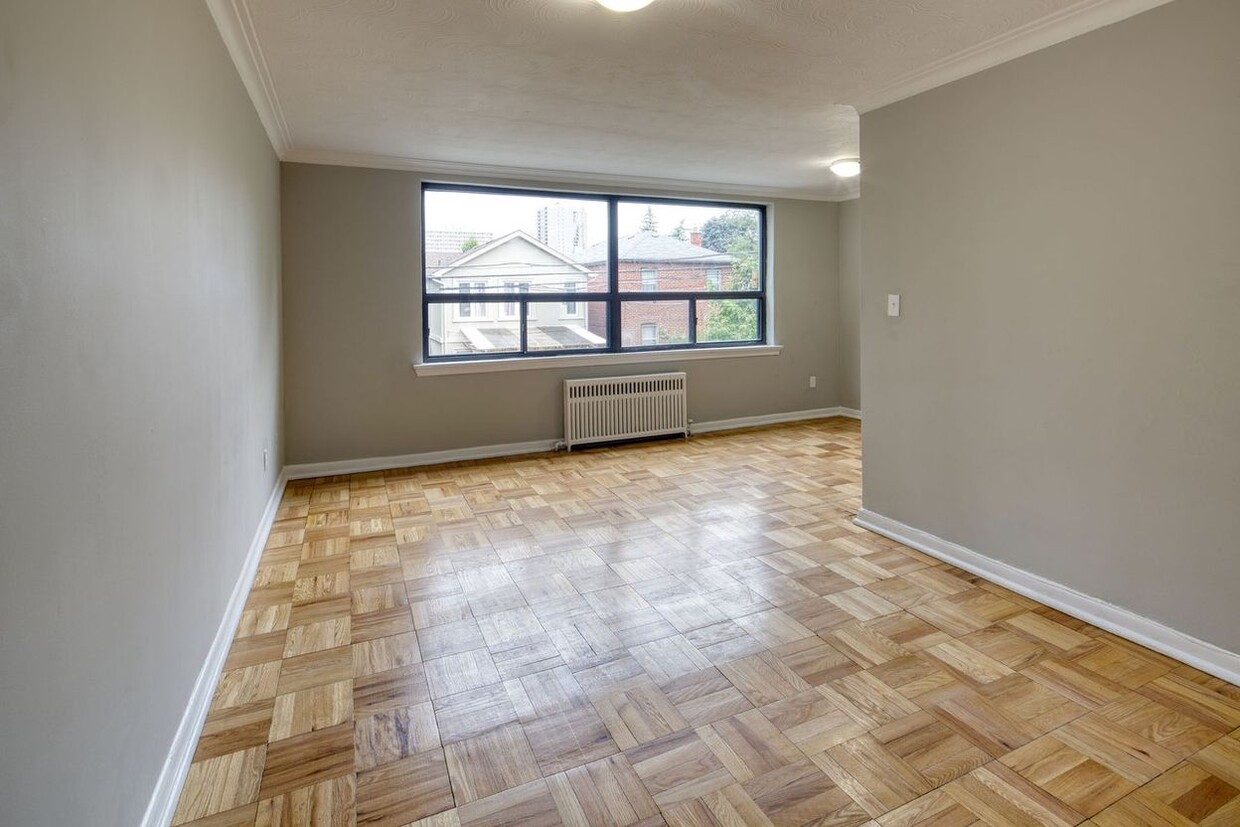 Building Photo - Large renovated bachelor unit, available i...