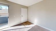 Located at 4555 Pine St in Riverside, CA, this one-bedroom, one-bathroom residence offers a thoughtfully designed single-floor layout with a comfortable and functional living environment. The open-concept living and dining area features plush carpeting, neutral warm-toned walls, a ceiling fan, and a textured ceiling, creating a welcoming atmosphere. Natural light filters in through a sliding glass door that leads to a private balcony, adding an outdoor extension to the living space. The kitchen is well-appointed with white shaker cabinetry, stainless steel appliances including a refrigerator, electric range, and microwave, light wood-look flooring, and a peninsula with a quartz-style countertop that doubles as a breakfast bar. The generously sized bedroom is carpeted and includes a ceiling fan, a window for natural light, and two closets offering ample storage. The bathroom features a stylish blue vanity with a speckled countertop, a large mirror, wood-look flooring, and a full tub/shower combination. A dedicated utility room rounds out the practical amenities of this well-maintained Riverside residence.