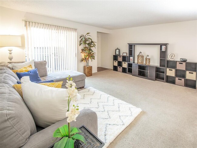 Warm And Inviting Living Room - Courtyard at Central Park Apartments