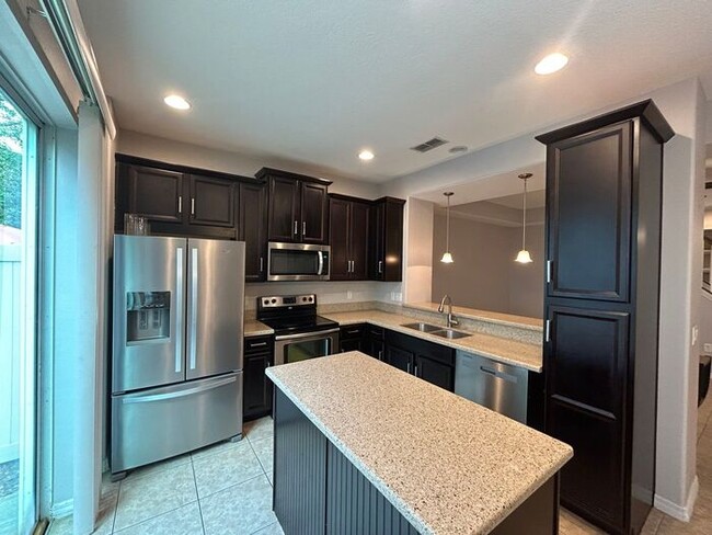 Building Photo - Stunning 3/2.5 Modern Townhome with a 2 Ca...