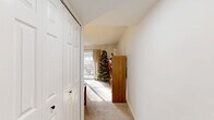 Located at 8732 Town and Country Blvd in Ellicott City, MD, this 2-bedroom, 1-bathroom home offers a thoughtfully arranged single-floor layout that maximizes comfort and functionality. The bright living room features plush carpeting, neutral walls, and ample natural light, creating a welcoming atmosphere. It flows into the dining area, which connects to the kitchen — outfitted with white cabinetry, light stone countertops, and stainless steel appliances, including a gas range, all set on light hardwood-style flooring. The primary bedroom is generously sized, featuring soft carpeting, a dedicated closet, and a calm, neutral palette. The second bedroom also offers carpeted flooring and a sliding closet, with a hallway connecting both rooms. The full bathroom is finished in clean white with a tub-shower combination and hardwood-style flooring. A private patio extends the living space outdoors, offering tranquil views of a landscaped hillside with mature trees — a peaceful retreat. Two hallways provide practical circulation throughout the home. The overall ambiance is light, airy, and move-in ready, ideal for those seeking a comfortable and efficiently designed residence in a well-established Ellicott City community.
