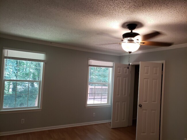 Living room with large windows - 413 E 2nd St