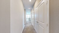 Located at 9641 N Ambassador Dr in Kansas City, MO, this well-designed residence offers three bedrooms, three bathrooms, and a thoughtful single-floor layout that maximizes comfort and functionality. The open-concept kitchen and living area serves as the heart of the home, showcasing rich dark cabinetry, granite countertops, a large central island, a subway tile backsplash, and a full suite of stainless steel appliances. Light wood-style flooring flows through the kitchen and bathrooms, while plush carpeting adds warmth to the living and bedroom areas. The spacious primary bedroom features multiple windows that invite abundant natural light and offer pleasant outdoor views, complemented by a ceiling fan and a dedicated walk-in closet with built-in shelving and hanging rods. Additional bedrooms are generously sized with large windows and access to closet storage. Each of the three bathrooms is finished with granite vanity tops, dark wood cabinetry, and wood-look flooring, with one bathroom featuring a soaking tub. Two well-organized closets provide ample storage throughout the residence. Neutral tones and consistent finishes create a cohesive, modern ambiance across all rooms.