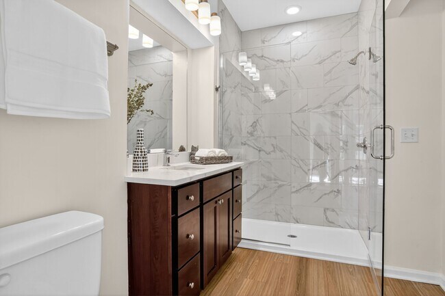Refined Bathroom | Luxury Spa Shower & Generous Storage - Luxe at Union Hill