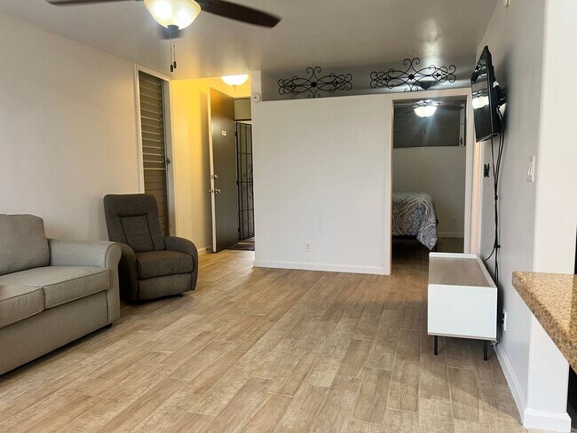Building Photo - One bedroom semi-furnished bottom floor condo