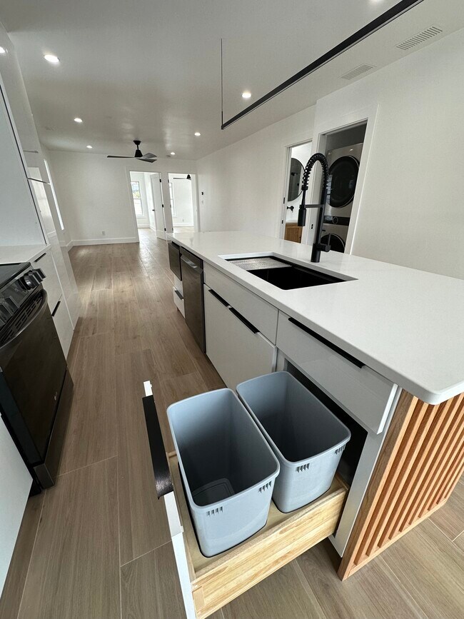 Kitchen island with trash / recycle - 1285 W 67th St