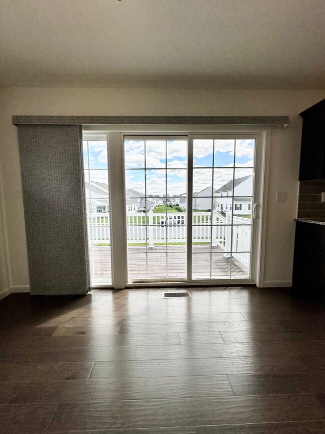 View from Dining Room out of 3-panel slider to deck & back of house - 1618 Haralson Dr