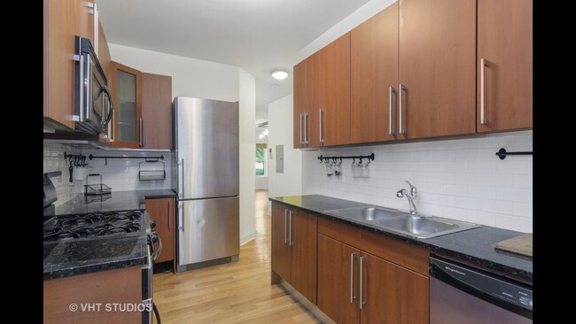 Large refrigerator with loads of space, along with tons of cabinet space - 7327 N Paulina St