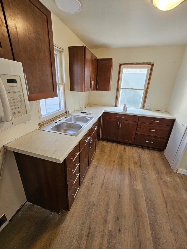 Newly renovated kitchen with brand new stove & dishwasher on the way. New flooring - 144 Coolidge St