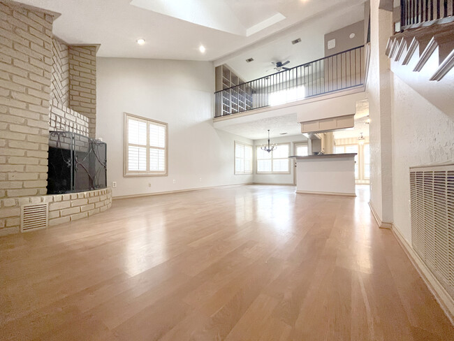 Wide open floor plan boasts high ceilings with easy flow between kitchen,and a cozy corner fireplace - 2914 Broadmoor Dr