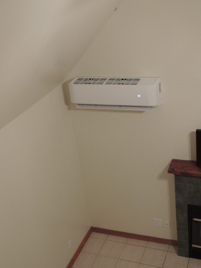 New 'Mr. Cool' Mini-split HVAC in living room. - 910 Perry Ln