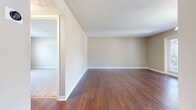 Located at 541 Oak Reserve Ln in Winter Park, FL, this 1-bedroom, 1-bathroom residence offers a well-organized single-floor layout designed for comfortable everyday living. The entrance opens into a generous living area featuring rich, warm-toned hardwood flooring, neutral beige walls, and a textured ceiling that adds depth to the space. Natural light filters in through a glass-paned entry door, creating an inviting atmosphere throughout.

The kitchen is well-appointed with light maple cabinetry, granite-style countertops, a mosaic tile backsplash, and tile flooring. It includes a double-basin sink, dishwasher, and range, with a window above the sink providing additional natural light and ventilation.

An elegant pendant light fixture highlights the dining area, which also benefits from dual windows and a glass door that opens to the outdoors, filling the space with ample natural light.

The spacious bedroom is finished with plush carpeting and features a large window that brings in natural light. It is complemented by a dedicated walk-in closet equipped with built-in wire shelving, offering generous storage capacity.

The bathroom includes a full soaking tub with white tile surround. Throughout the home, clean white baseboards and a consistent neutral color palette create a cohesive, move-in-ready aesthetic.
