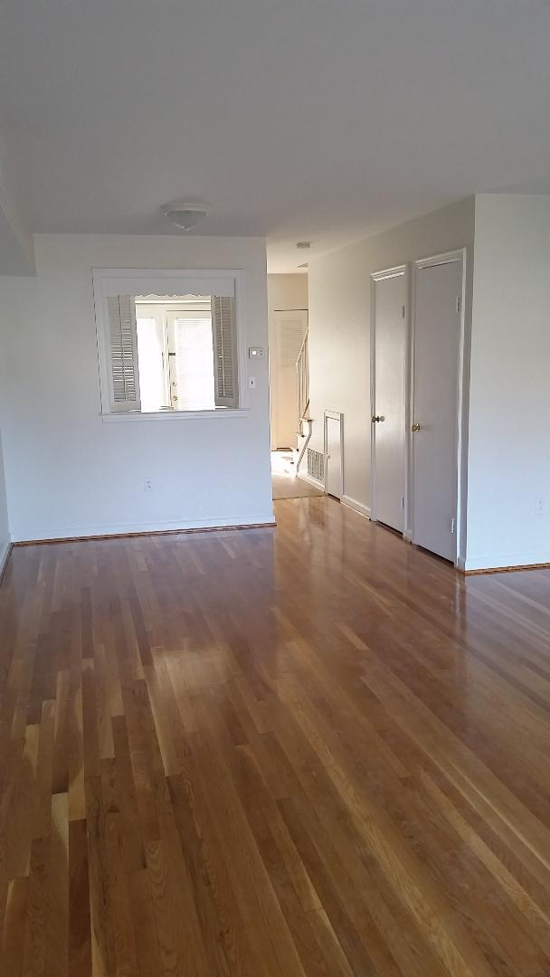 Bottom floor living area looking into the kitchen. - 1801 Grandin Rd SW
