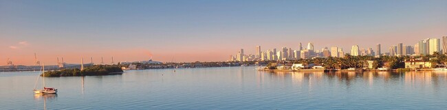 The early morning glow reflecting off of the Miami skyline. - 3 Island Ave