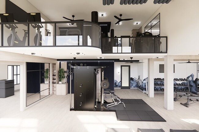 Gimnasio de dos plantas totalmente equipado con equipos Technogym - The Residence Peninsula Apartments