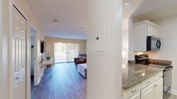 This single-floor residence offers a clean, modern aesthetic throughout, unified by light wood-look flooring and a soft neutral color palette. The open living area is a welcoming focal point, featuring a sliding glass door flanked by vertical blinds that allows natural light to fill the space and provides views of the outdoors. The room comfortably accommodates a sofa, ottoman, and accent chair arrangement, with a wall-mounted television adding a practical touch.

The kitchen is efficiently designed in a galley-style layout, featuring granite countertops, white cabinetry, and stainless steel appliances including an electric range and over-the-range microwave. The countertops provide ample workspace, while the cabinetry offers generous storage.

The bedroom is a serene, well-proportioned retreat bathed in natural light from a large window fitted with horizontal blinds. Neutral walls and continued wood-look flooring maintain the cohesive design language found throughout the unit.

The bathroom is neatly appointed with a vanity featuring a warm-toned countertop, a mirrored medicine cabinet, and a tub-shower combination enclosed by sliding glass doors with chrome fixtures, including accessibility grab bars. The overall ambiance of the space is calm, functional, and move-in ready.