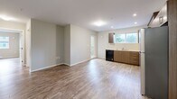 Located at 3142–3148 Jacklin Rd in Langford, BC, this single-floor, three-bedroom, two-bathroom unit offers a clean and modern living environment with a practical, well-organized layout. Throughout the unit, warm-toned luxury vinyl plank flooring provides a cohesive look, complemented by neutral walls and crisp white trim.

The open-concept living and dining area is bright and spacious, featuring a ductless mini-split system for efficient year-round climate control. The kitchen is equipped with warm wood-toned cabinetry, a built-in dishwasher, and a window that brings in natural light and views of the surrounding greenery. A sliding door provides access to a private balcony, adding to the unit's connection to the outdoors.

The primary bedroom is generously sized, offering ample room for furnishings, while the two additional bedrooms each feature windows that allow natural light and views of the neighbourhood. A dedicated closet provides convenient storage.

Both bathrooms are finished consistently with wood-toned vanities, light countertops, tub-shower combinations, and tile-style flooring. A dedicated laundry room houses a full-sized side-by-side washer and dryer with overhead shelving, adding everyday convenience. The hallway connects all rooms efficiently, completing this well-appointed residential unit.