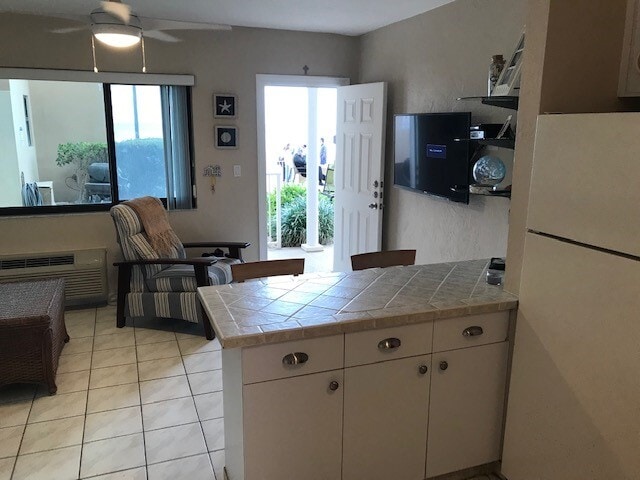 View from kitchen to living room - 3300 N Surf Rd