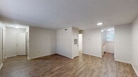Located at 567 Sharp Ln in Baton Rouge, Louisiana, this one-bedroom, one-bathroom unit offers a practical and efficient single-floor layout. Throughout the main living areas, wood-look laminate flooring provides a clean, cohesive aesthetic, while neutral-toned walls and textured ceilings create a simple, understated interior. The open living room receives natural light through a window fitted with horizontal blinds, lending the space a bright and airy feel. Adjacent to the living area, the galley-style kitchen is efficiently arranged with white cabinetry, a built-in range, and a full-size refrigerator, complemented by a window that adds natural light to the workspace. The bedroom features plush carpeting and a dedicated window for natural light, along with access to two closets, offering ample storage. The full bathroom includes a tiled tub-and-shower combination, a toilet, and a vanity with under-sink storage, finished with wood-look flooring that ties into the rest of the unit. HVAC vents are present throughout, ensuring year-round climate comfort. This unit provides a straightforward, functional living space well-suited for those seeking an efficient home in Baton Rouge.