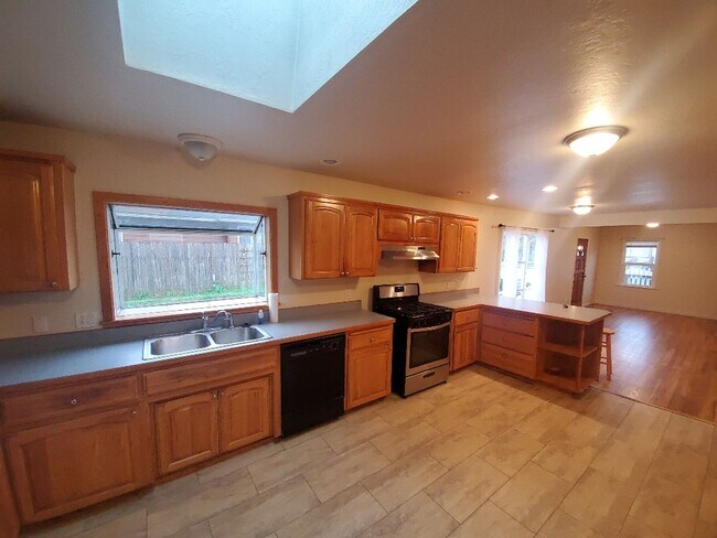 Building Photo - 3-bedroom home with new flooring and fresh...