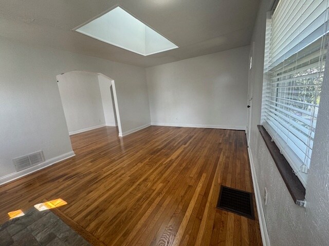 Original wood floors and skylight bring an abundance of light - 7231 Osceola Dr