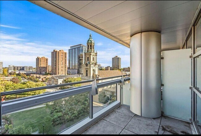 Large Covered Balcony with peak view of lake - 545 E Wells St