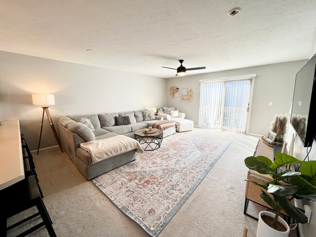 Living room with front deck access - 20 Sunridge Dr