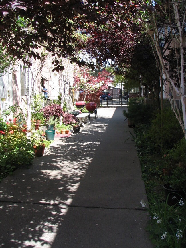 Space for tenants' potted plants, chairs, tables, and barbecues. - 1624 T St