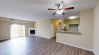 Located at 725 Bridgeport Ave in Streetsboro, Ohio, this well-appointed 3-bedroom, 2-bathroom single-floor home offers a comfortable and functional layout. The open-concept living and dining area serves as the heart of the home, featuring warm wood-look laminate flooring, a ceiling fan with light fixture, and a classic tiled fireplace that adds a cozy focal point to the space. Natural light filters in through a sliding glass door, enhancing the bright and airy atmosphere.

The kitchen is efficiently designed with crisp white shaker-style cabinetry, ample counter space, a double stainless steel sink, and a full suite of appliances including a refrigerator and microwave. A breakfast bar connects the kitchen to the living area, creating a seamless flow ideal for entertaining.

The spacious primary bedroom features plush carpeting, a ceiling fan, and a private en-suite bathroom complete with a walk-in shower, white vanity, and wood-look flooring. A second full bathroom offers a soaking tub, single vanity, and matching finishes. Two additional bedrooms provide comfortable accommodations, each with carpeting and generous natural light. The home also includes a dedicated laundry area with an in-unit washer and dryer, four closets for abundant storage, and a utility room, rounding out this practical and inviting residence.