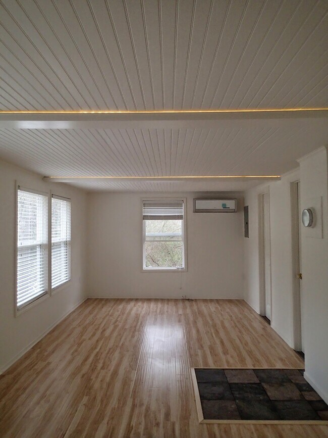 Living room currently has a divider; can be left in place or removed if you prefer. - 169 Cragmont Rd