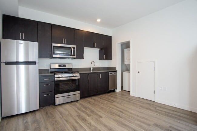 Building Photo - Modern & Sleek One-Bedroom Townhouse Ready...