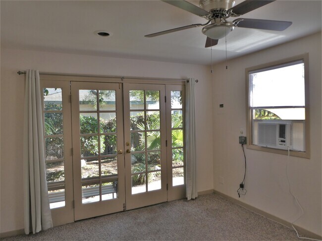 View of garden and entry from main room - 11553 La Maida St