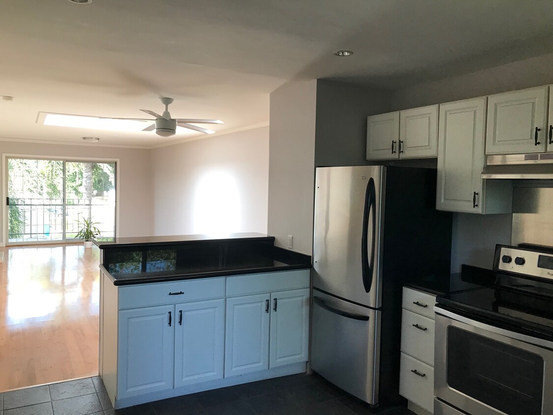 View of kitchen and the great room - 6484 Cavalleri Rd