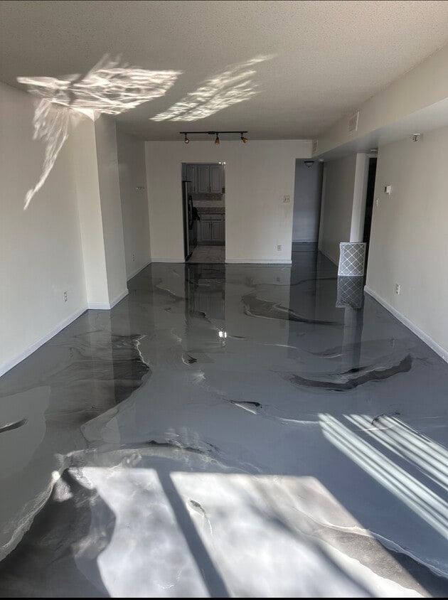 Living/ Dinning Area: With New epoxy flooring - 9200 Edwards Way (Adelphi, MD)