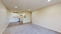 Located at 12002 Wintercrest Drive in Lakeside, CA, this well-appointed one-bedroom, one-bathroom residence offers a thoughtfully designed single-floor layout. The open-concept living and kitchen area serves as the heart of the home, where light-toned walls and recessed lighting create a bright, welcoming atmosphere. The living area features plush carpeting, providing a comfortable space for relaxing or entertaining, and a sliding glass door leads to a private balcony with views of the surrounding greenery.

The kitchen is a standout feature, showcasing white shaker-style cabinetry with brushed nickel hardware, light quartz countertops, a stainless steel double sink, and a full suite of stainless steel appliances including a refrigerator, dishwasher, microwave, and range. Durable wood-look flooring runs throughout the kitchen, adding warmth and easy maintenance.

The bedroom offers a comfortable retreat with soft carpeting, a window overlooking the outdoors, and a dedicated closet for ample storage. The bathroom is clean and functional, featuring a full tub-shower combination with chrome fixtures and a window for natural light. A dedicated closet completes the unit, providing additional organized storage throughout.