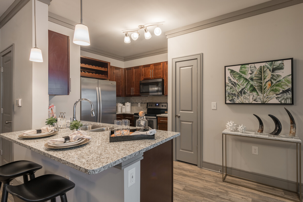 Modern Kitchens with oak shaker-style cabinetry, pendant lighting, granite countertops, and stainless steel appliances - Avalon Perimeter Park