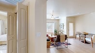 This thoughtfully designed 2-bedroom, 4-bathroom single-story residence offers a cohesive and comfortable living environment finished with warm, neutral tones throughout. Light wood-style flooring flows continuously across the space, lending a clean and airy aesthetic.

The living room serves as the heart of the home, featuring a ceiling fan, a large window with blinds that invites generous natural light, and an open archway that connects seamlessly to the rest of the unit. The kitchen is outfitted with wood-grain cabinetry, light countertops, a double stainless steel sink, a stainless steel range, and a dishwasher — all centered around a window that keeps the space bright and functional.

Both bedrooms are comfortably sized, with the primary bedroom offering ample room for a full bedroom suite. The four bathrooms are well-appointed, featuring glass-enclosed walk-in showers with large-format tile surround, wood-tone vanities with marble-style countertops, and light tile flooring that complements the overall design palette.

A dedicated in-unit laundry room houses a full-size top-loading washer and dryer with overhead shelving for added storage. Additional spaces include a hallway, a closet, and well-distributed storage throughout. The overall ambiance is clean, modern, and inviting.