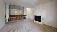 Located in the Westwood neighborhood of Los Angeles, this single-floor residence at 606 Levering Ave offers a functional and comfortable layout with several notable features throughout. The living room serves as the heart of the space, anchored by a white-paneled corner fireplace and carpeted flooring that extends across the main living areas. A mirrored wall accent and a dark wood railing detail add visual interest, while a textured popcorn ceiling is consistent throughout the unit. The dining area is brightened by a classic chandelier and sliding glass doors that open onto a private balcony, allowing natural light to flow in and providing outdoor views of the surrounding neighborhood. The kitchen is equipped with dark wood cabinetry reaching toward the ceiling for ample storage, light countertops with a tile backsplash, a gas range, a white refrigerator, a dishwasher, and tile flooring. A breakfast bar-style counter connects the kitchen to the dining and living areas. The bathroom features tile flooring, a vanity with light wood cabinetry, and a separate water closet. Throughout the unit, the layout is open and straightforward, offering a practical living environment in a prime Los Angeles location.