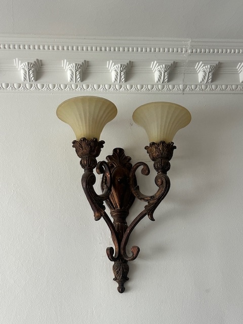 Close-up view of the right iron wall sconces on dimmer switches. - 1859 1/2 Pandora Ave