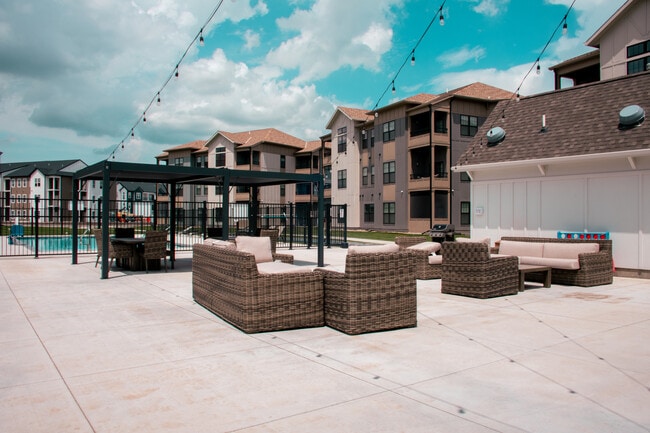 The clubhouse patio is ready for relaxation. - Legacy 34