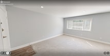 This 730 square foot single-floor residence in Woodbridge, VA offers a well-designed living space with three bedrooms, including a spacious 400 square foot primary bedroom. The property features a neutral color palette throughout, with light gray walls and plush beige carpeting in the bedrooms, creating a bright and airy atmosphere. Large windows in each room allow ample natural light to flood the space, while also providing views of the surrounding greenery.

The bedrooms are generously sized, with the primary bedroom standing out due to its expansive 400 square foot area. Built-in closets with louvered doors offer practical storage solutions. Modern recessed lighting fixtures are installed in each room, complementing the overall contemporary design.

A central hallway connects the various rooms, enhancing the flow of the space. The property also includes a dedicated closet area for additional storage. The cohesive design elements, including consistent flooring and wall colors, create a seamless and harmonious living environment. This well-maintained space offers a blank canvas for personalization, making it an ideal choice for those seeking a modern, low-maintenance home in a desirable Virginia location.