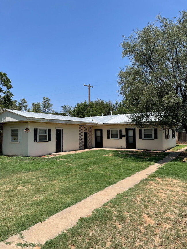 Building Photo - 2/1 with off street parking and large yard.