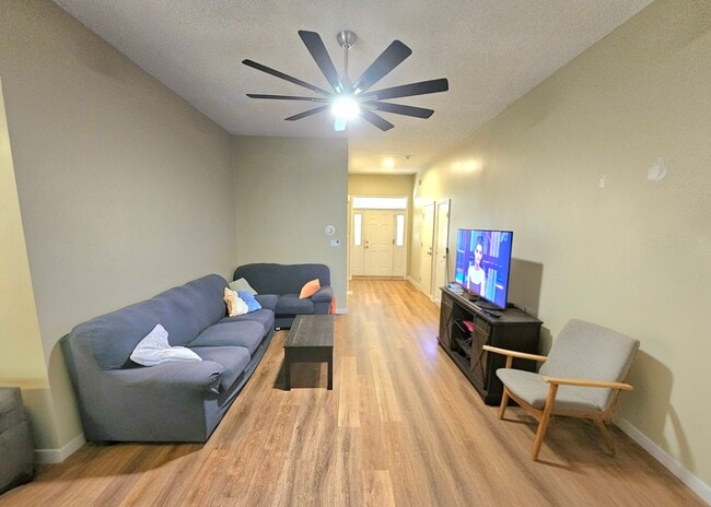Entryway with 55" tv, loveseat, couch, coffee table side chair not included) - 10430 Brawley Ln