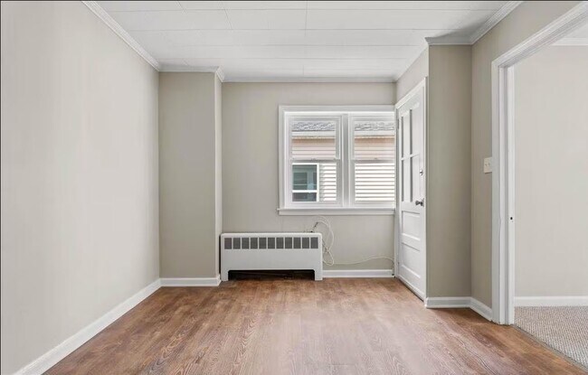 Living room with new windows - 225 E Hector St