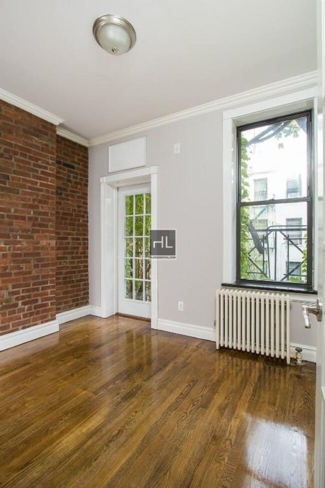 Building Photo - Bright Nolita 3-Bedroom with Skyline Views