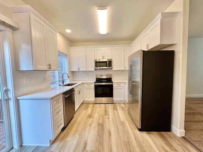 Building Photo - NEWLY RENOVATED! Spacious 2-Bedroom Townhome in a Charming Cul-de-Sac!