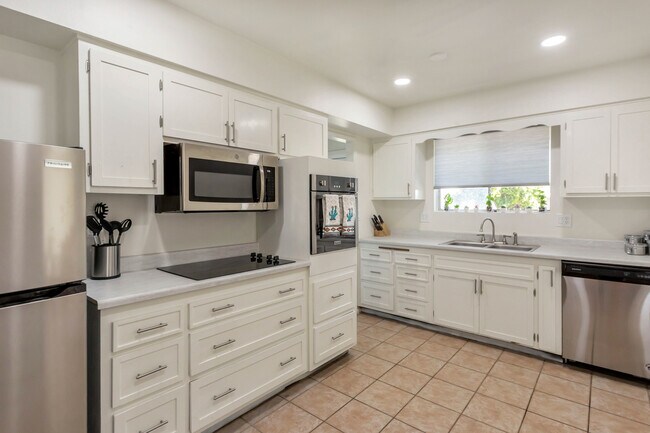 Eat In Kitchen with Indoor Laundry beyond - 10740 W Sun City Blvd