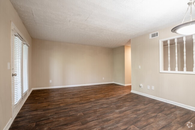 1BR, 1BA - 1,037SF - Living Room - Crossing at Henderson Mill