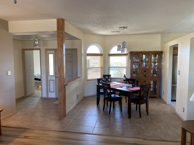 View of dining room, showing the entry. - 6689 Augusta Hills Dr NE