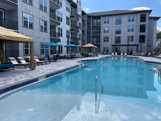 Experience luxury living with a resort-style pool at this stunning apartment complex. - The Juliette